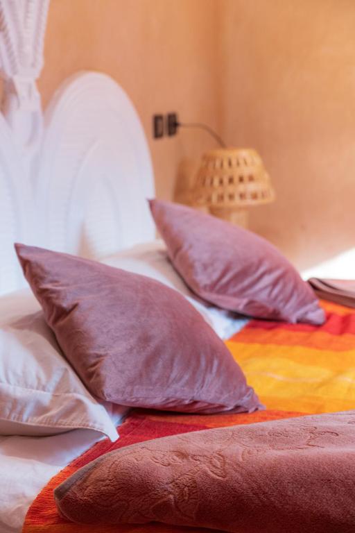 Postel nebo postele na pokoji v ubytování Riad Tourtit