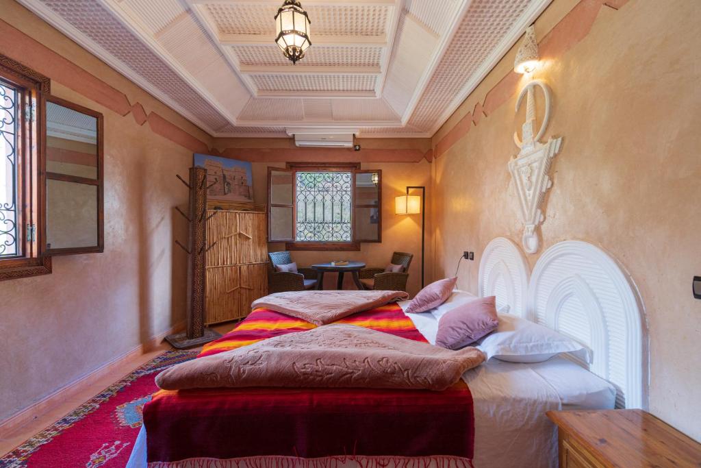 Postel nebo postele na pokoji v ubytování Riad Tourtit