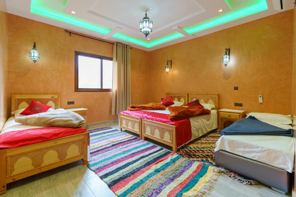 Postel nebo postele na pokoji v ubytování Riad Tourtit