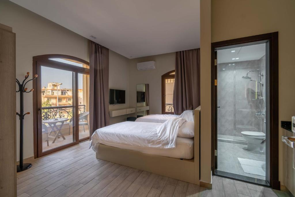 Postel nebo postele na pokoji v ubytování Sleep Inn Apart-Hotel