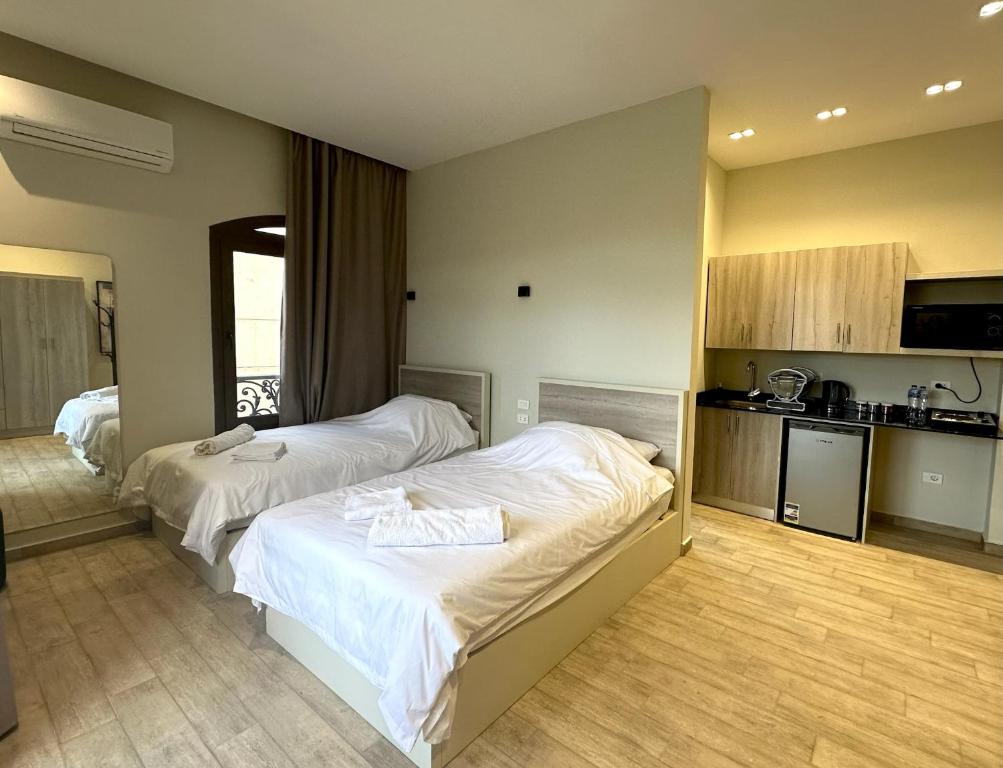 Postel nebo postele na pokoji v ubytování Sleep Inn Apart-Hotel