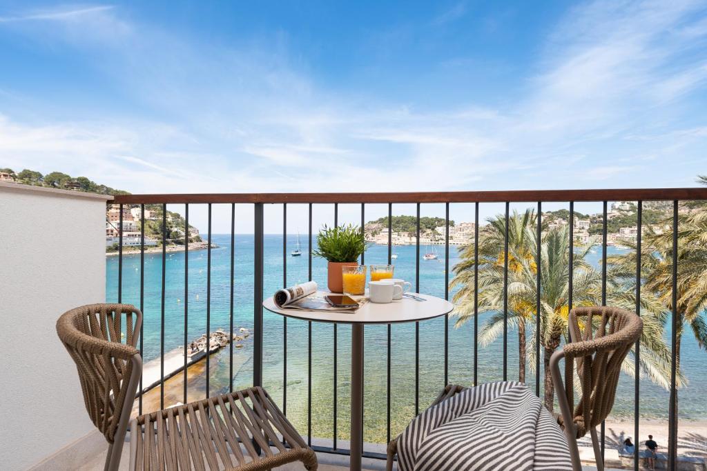 a balcony with a table and chairs and the ocean at Repic Apartments Soller in Port de Soller