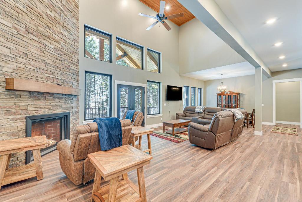 a living room with couches and a fireplace at Star Valley Ranch Vacation Rental with Resort Perks! in Thayne