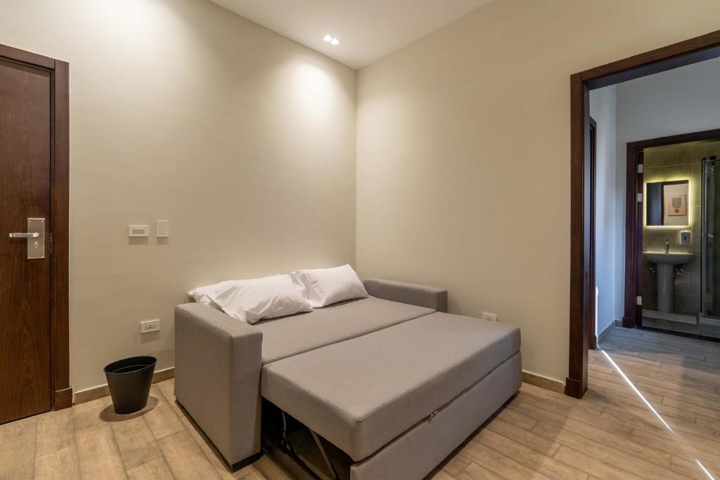 Postel nebo postele na pokoji v ubytování Sleep Inn Apart-Hotel