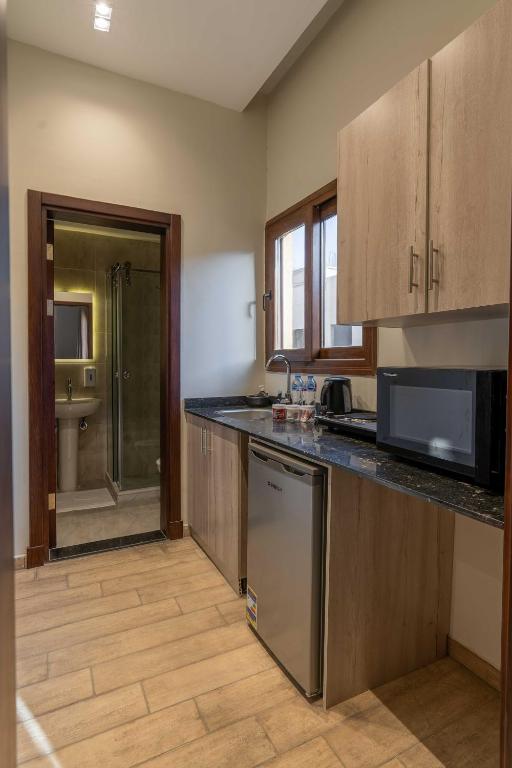 Kuchyň nebo kuchyňský kout v ubytování Sleep Inn Apart-Hotel