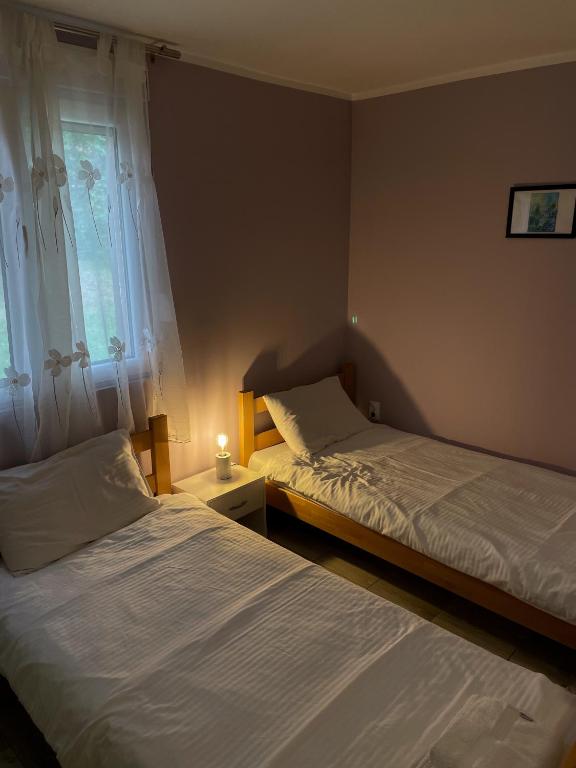 Postel nebo postele na pokoji v ubytování Apartmani Vera