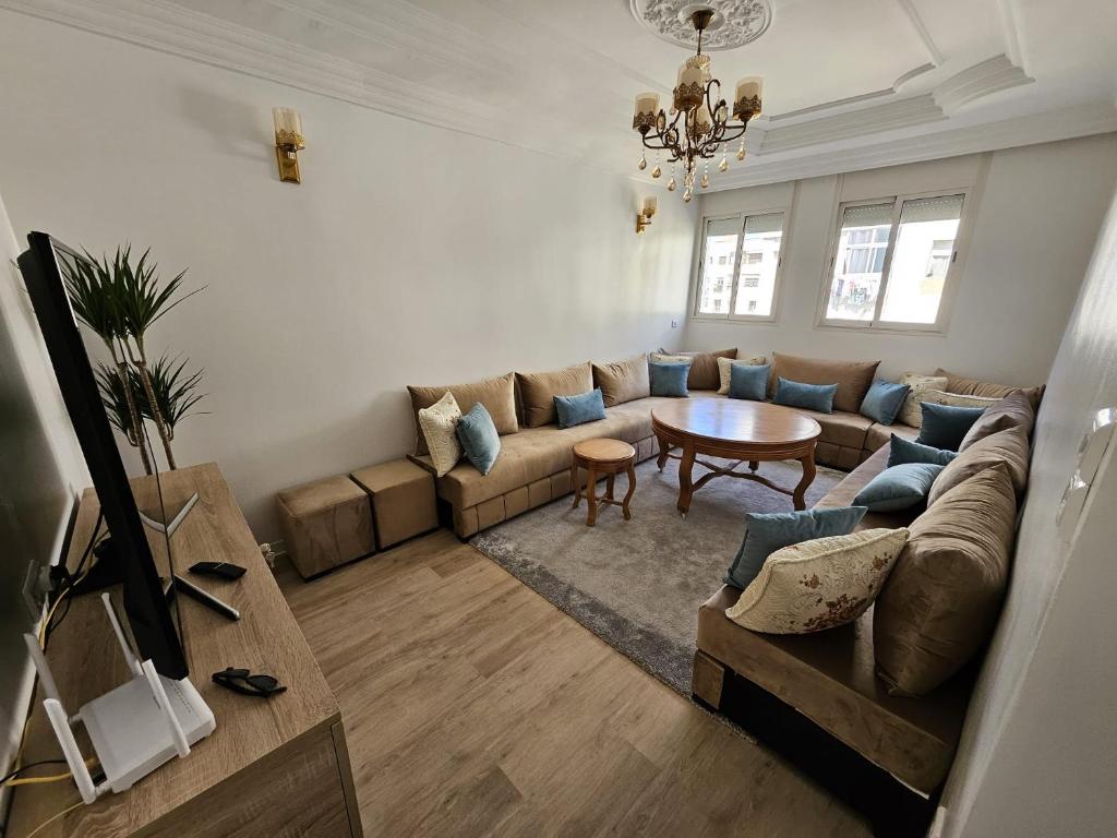 a living room with a couch and a table at Cosy and Complete Casa appartment in Casablanca