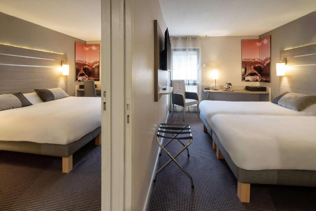 Postel nebo postele na pokoji v ubytování Best Western Voiron Centre