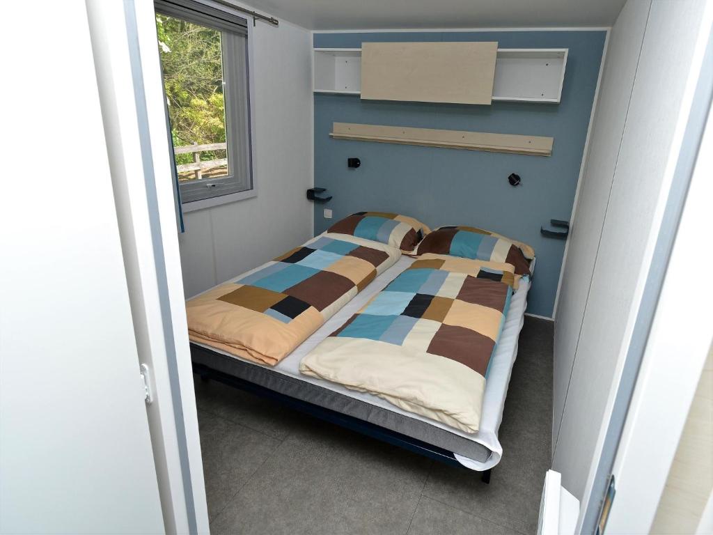 Postel nebo postele na pokoji v ubytování Mobile Home an der Drau