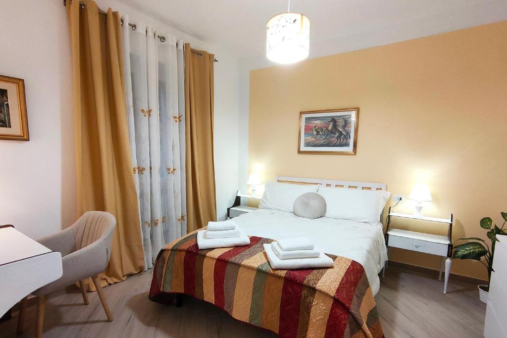 Postel nebo postele na pokoji v ubytování Lollo House Borgo Opifici