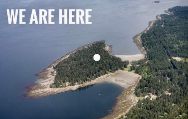 an island in the middle of a lake with the words we are here at Gabriola Island B&B By The Sea in Gabriola