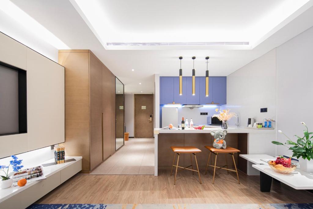 Kuchyň nebo kuchyňský kout v ubytování Changsha Zealandia Serviced Apartment
