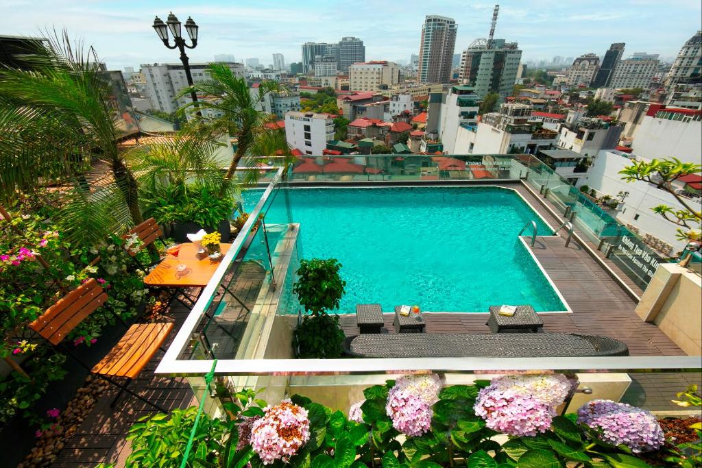 a swimming pool on the roof of a building at The Light Hotel in Hanoi