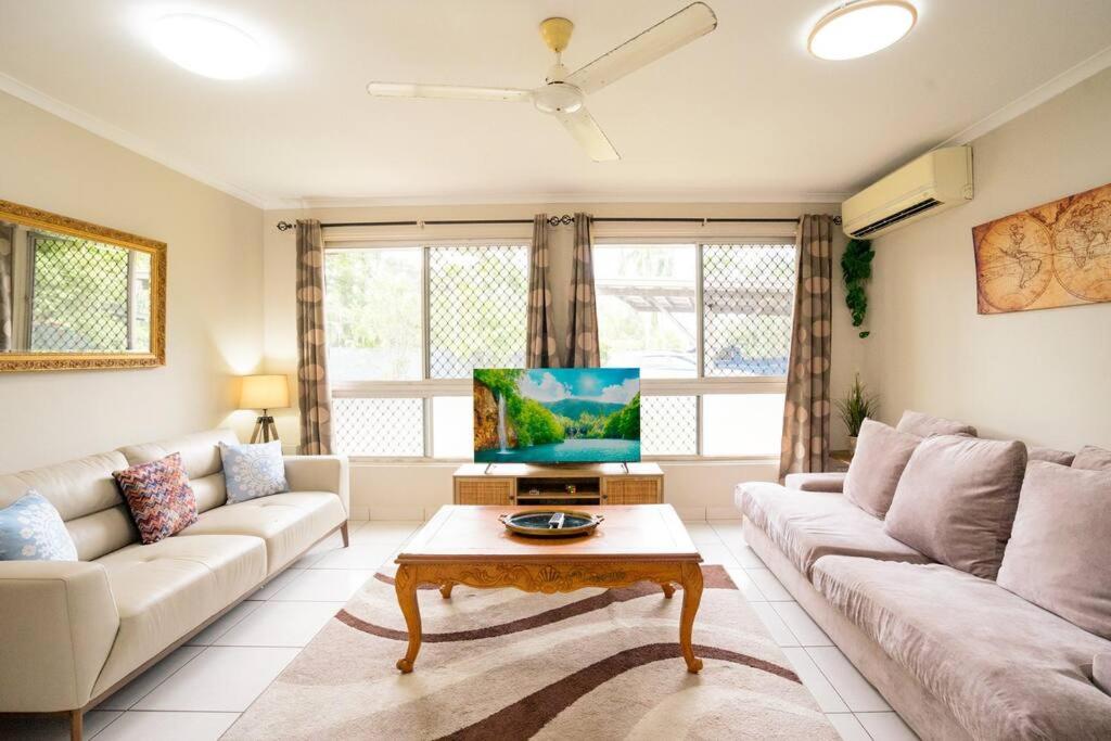 a living room with a couch and a table at Zenhouse Worker Accom-Trailer - Storage - Pets in Nightcliff