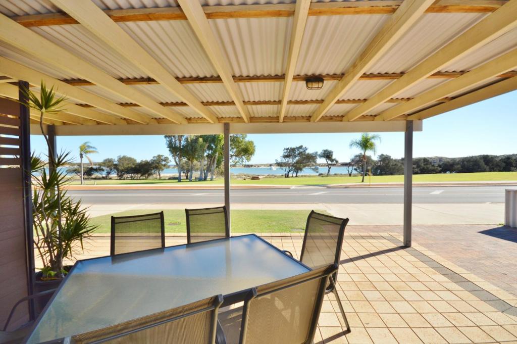 a table and chairs under awning on a patio at Kalbarri Waters A - Kalbarri WA in Kalbarri
