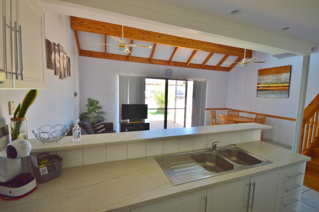 a kitchen with a sink and a counter top at Blue Ocean Villa 2 - Kalbarri WA in Kalbarri