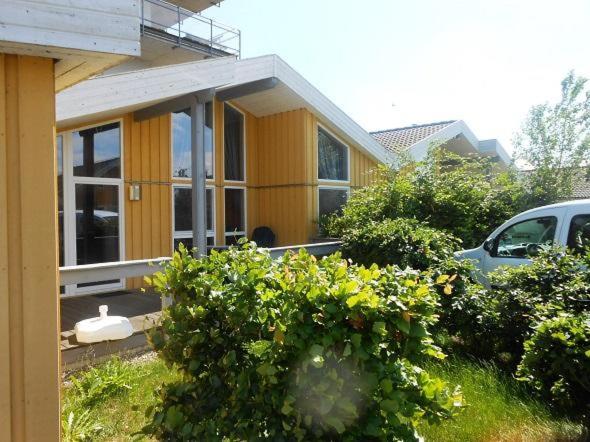 a house with a car parked in front of it at Haubentaucher 80 in Rechlin