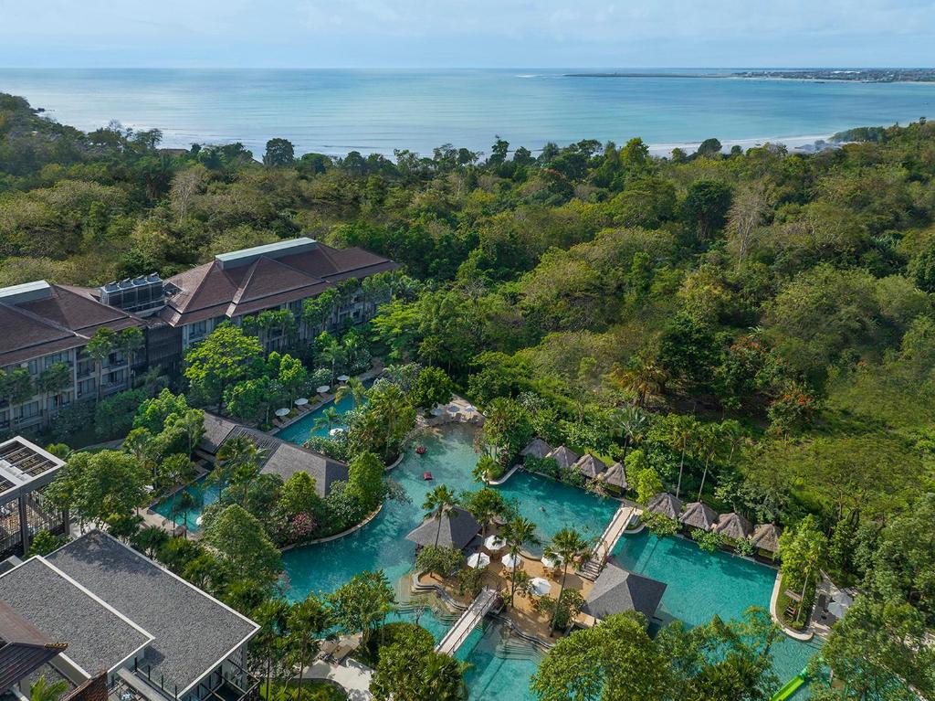 an aerial view of the resort and the water park at Mövenpick Resort & Spa Jimbaran Bali in Jimbaran