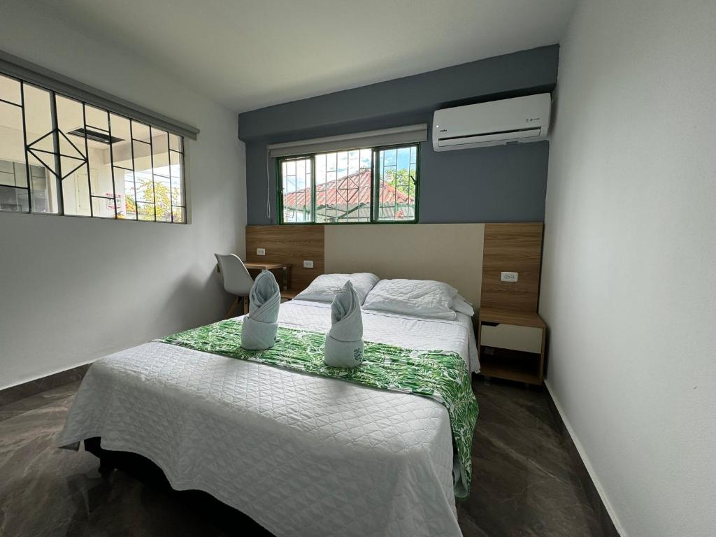 Postel nebo postele na pokoji v ubytování Hotel Maratea Melgar