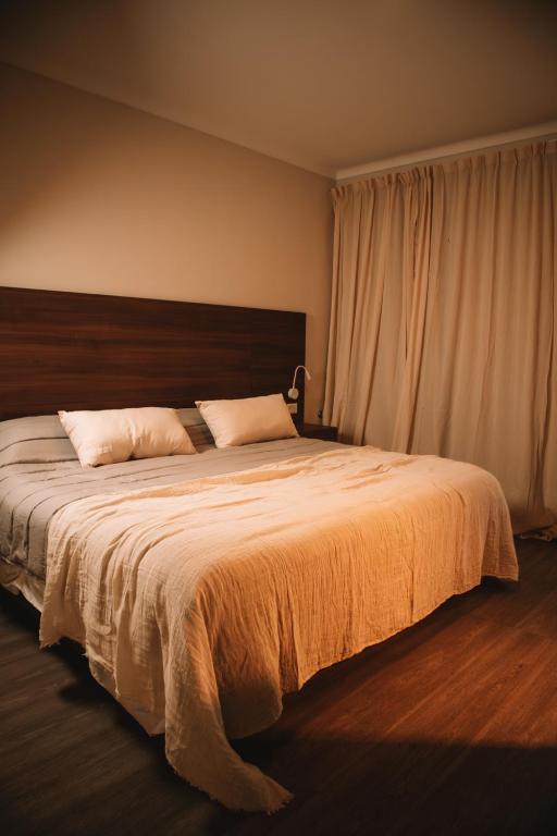 Postel nebo postele na pokoji v ubytování Catriel Suites