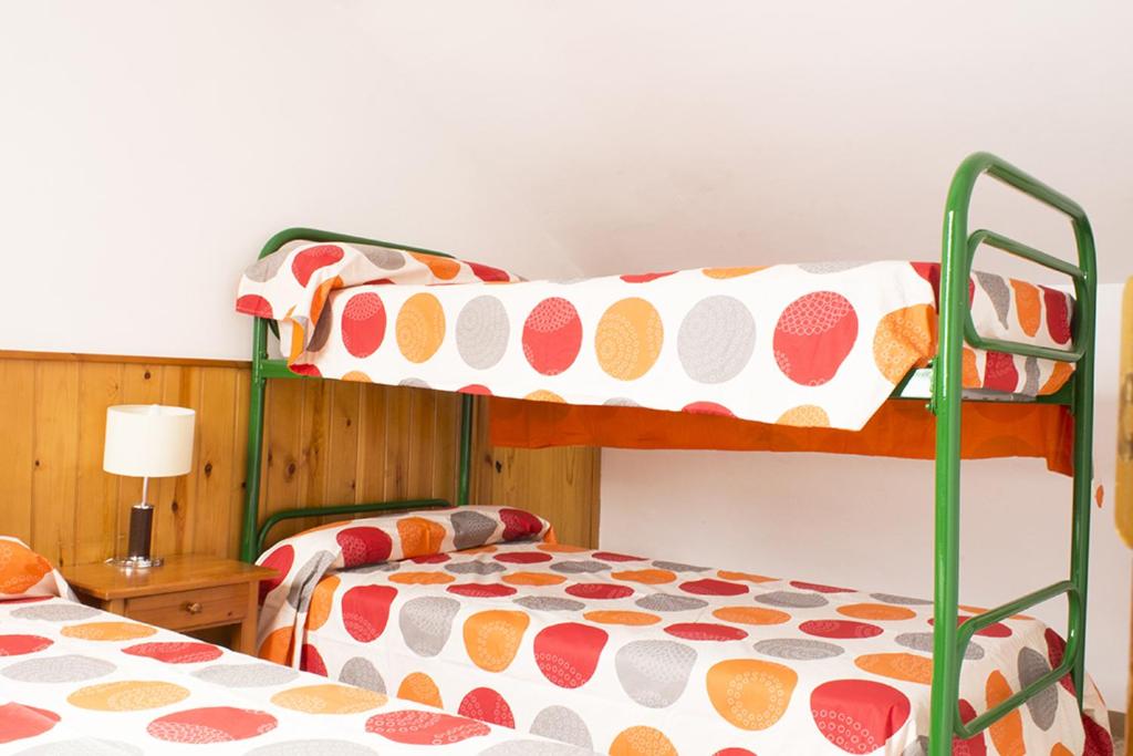A bed or beds in a room at Apartamentos Grist