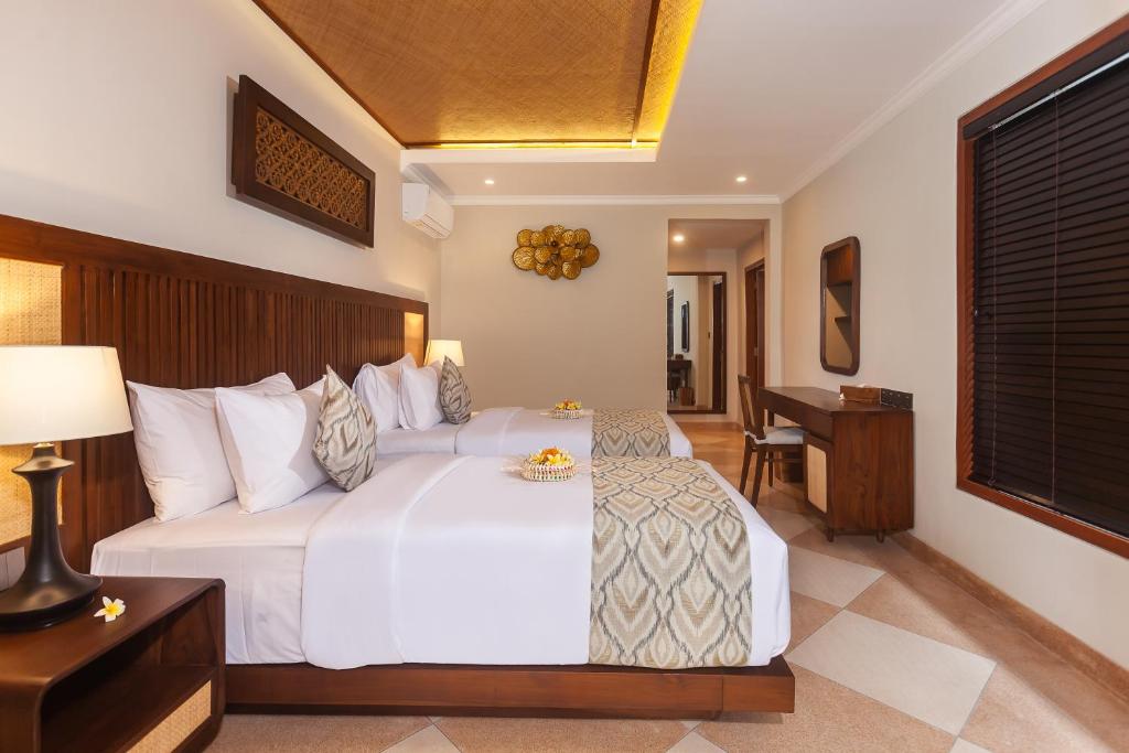 Postel nebo postele na pokoji v ubytování Ghana Villa Seminyak by Pramana Villas