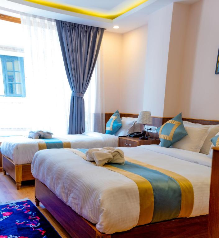 Postel nebo postele na pokoji v ubytování Hotel Yakroo Manang