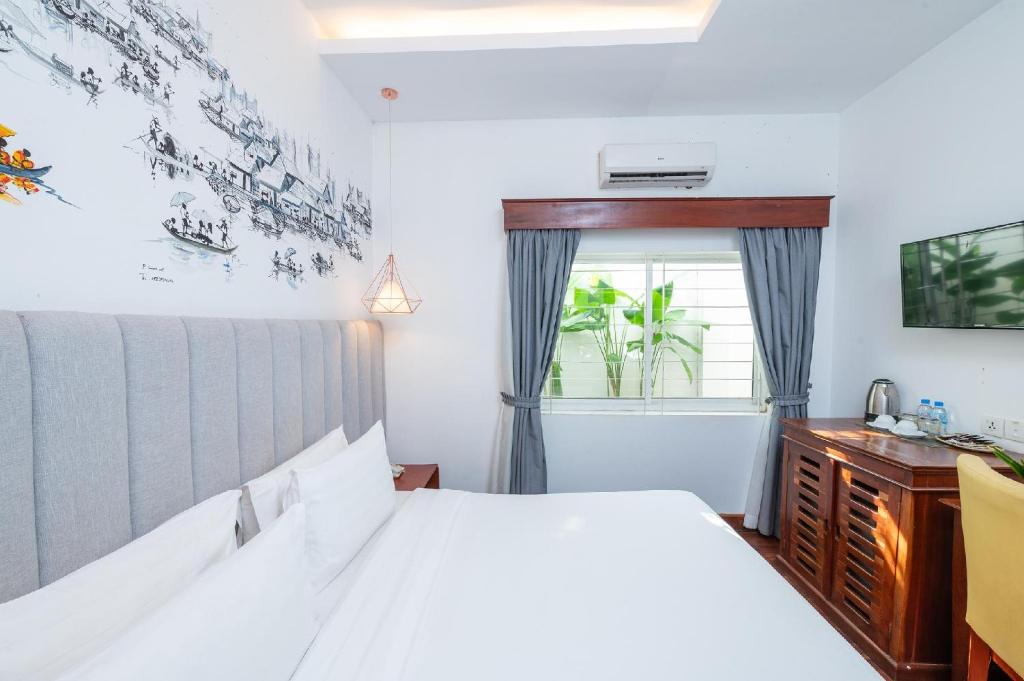 Postel nebo postele na pokoji v ubytování Victoria Central Residence