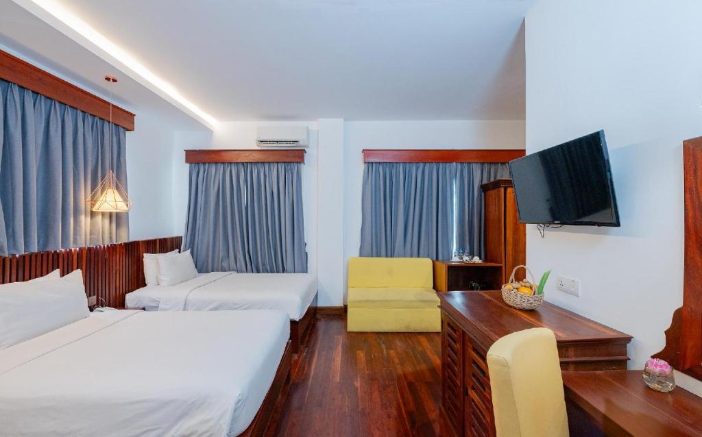 Postel nebo postele na pokoji v ubytování Victoria Central Residence