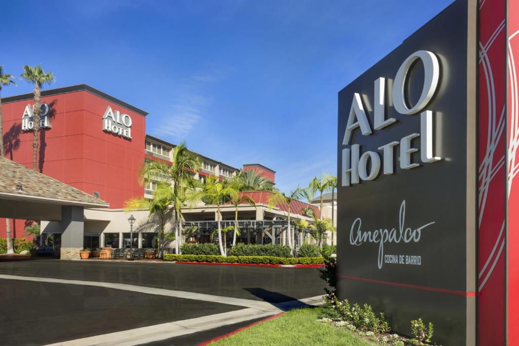 a large building with a sign on the side of it at ALO Hotel by Ayres in Anaheim