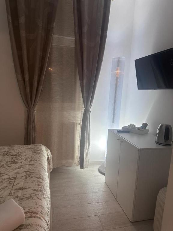 TV a/nebo společenská místnost v ubytování Altamarea Rooms