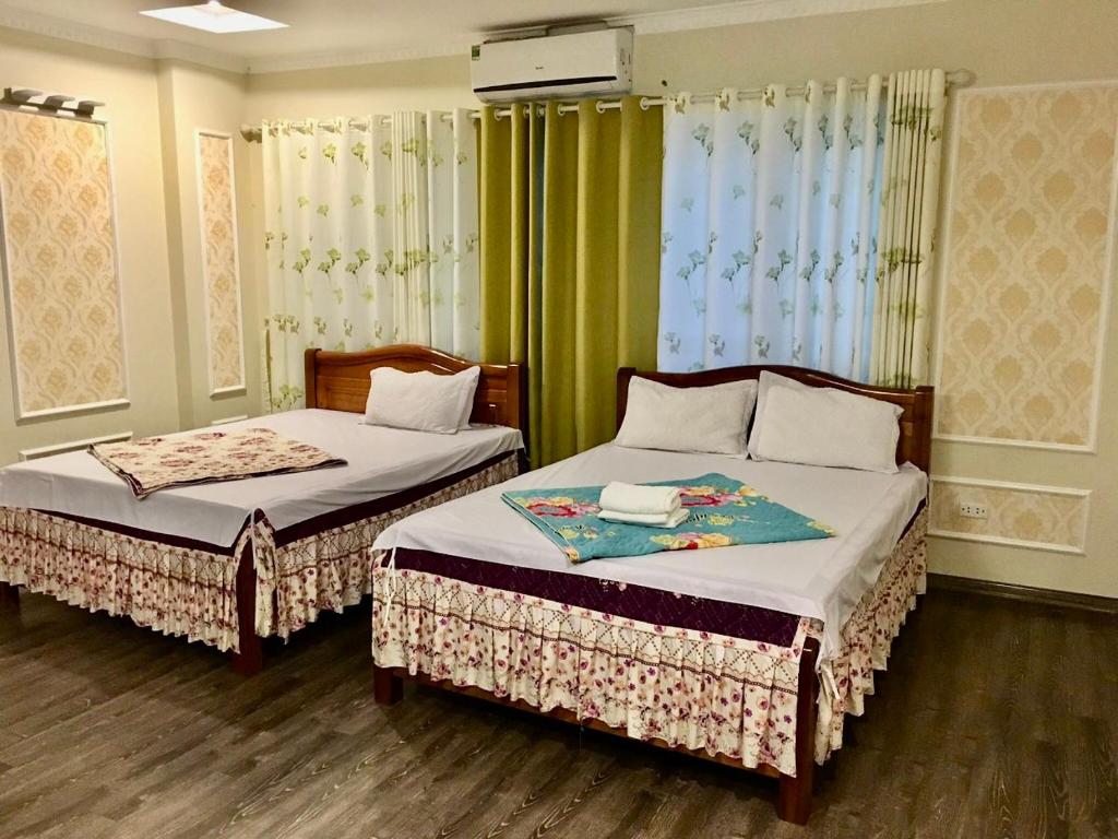 - 2 lits dans une pièce dans l'établissement Ánh Dương Hostel - Ng 45 Võ Chí Công - by Bay Luxury, à Hanoï