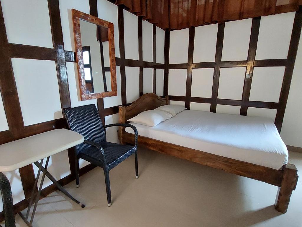 Postel nebo postele na pokoji v ubytování Yuken Mari Beach Resort Panglao