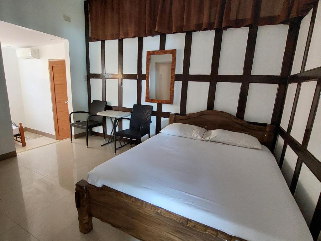 Postel nebo postele na pokoji v ubytování Yuken Mari Beach Resort Panglao