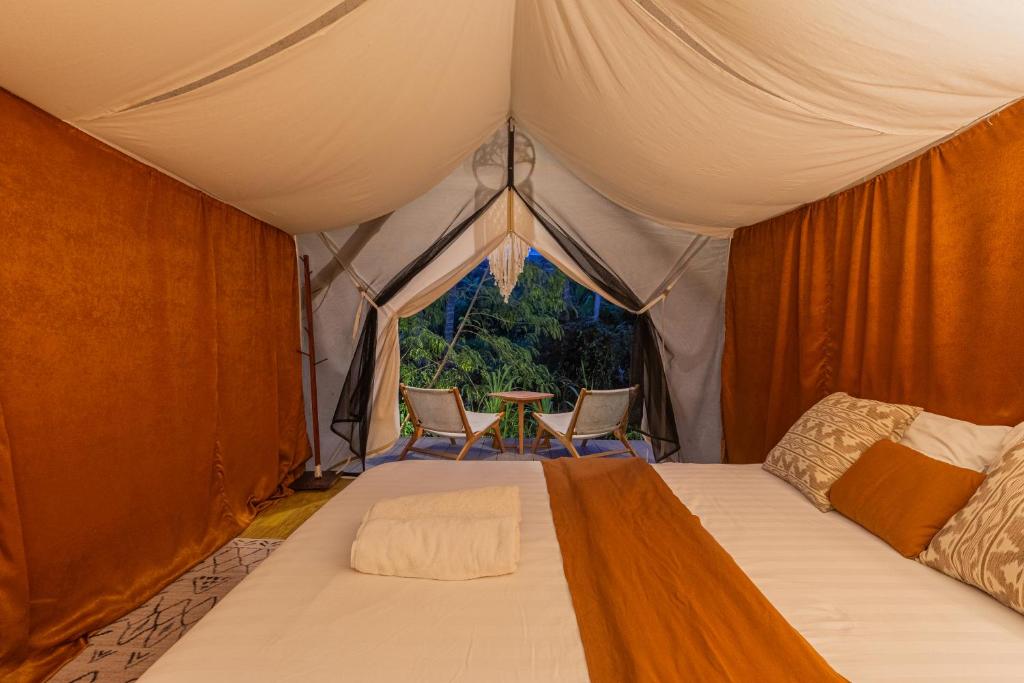 Postel nebo postele na pokoji v ubytování Camani Glamping