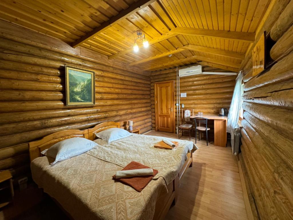 Postel nebo postele na pokoji v ubytování ЕЛІТ