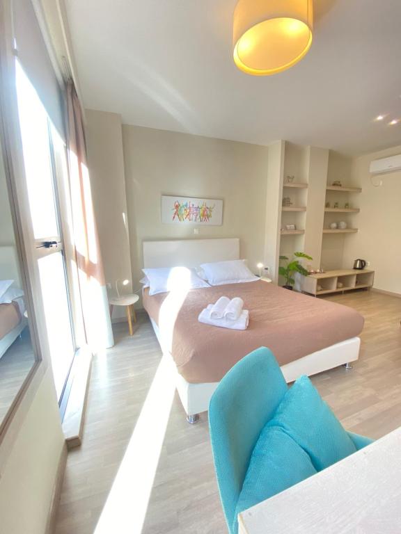 A bed or beds in a room at Tins Hotel City - Athens
