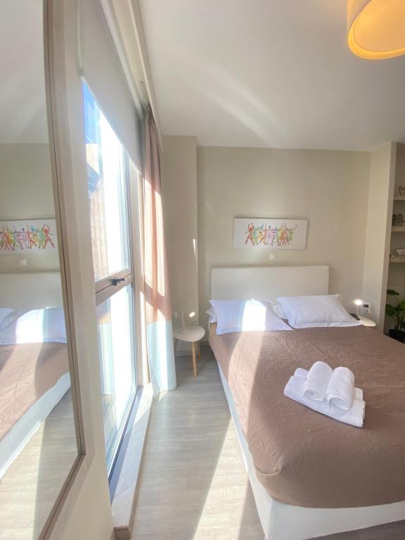 A bed or beds in a room at Tins Hotel City - Athens