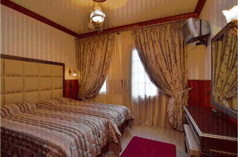 Postel nebo postele na pokoji v ubytování Hotel Apollon