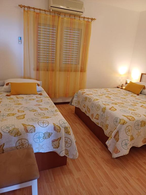 Posteľ alebo postele v izbe v ubytovaní Apartments Jure Miljak