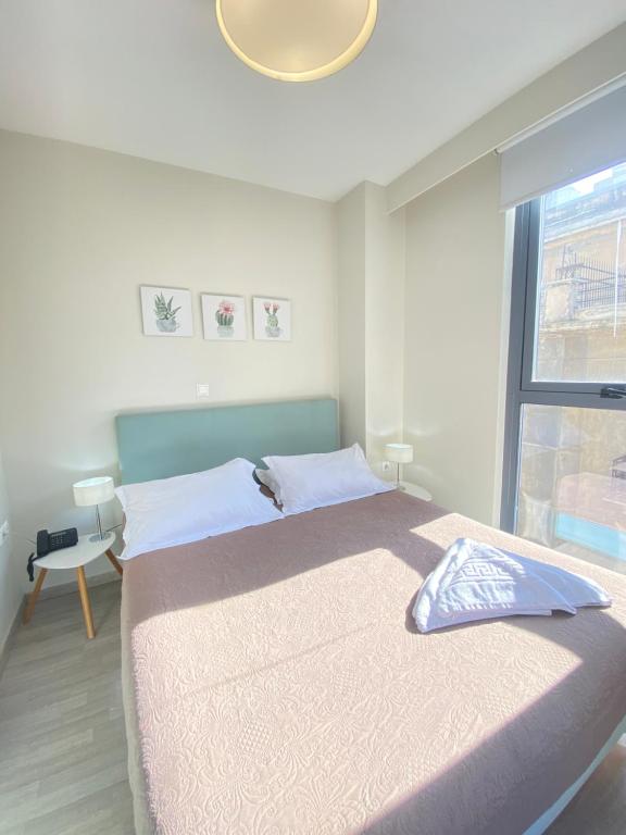 A bed or beds in a room at Tins Hotel City - Athens