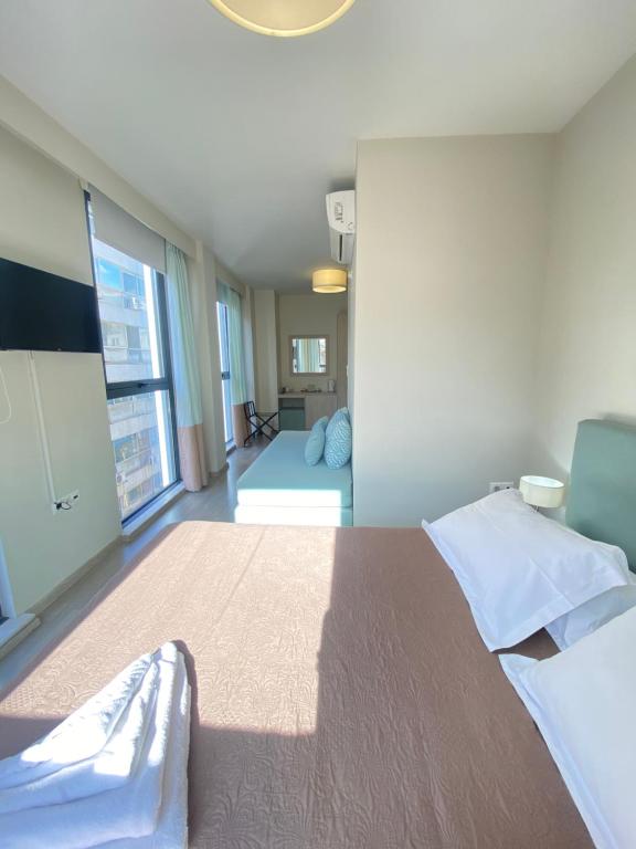 A bed or beds in a room at Tins Hotel City - Athens