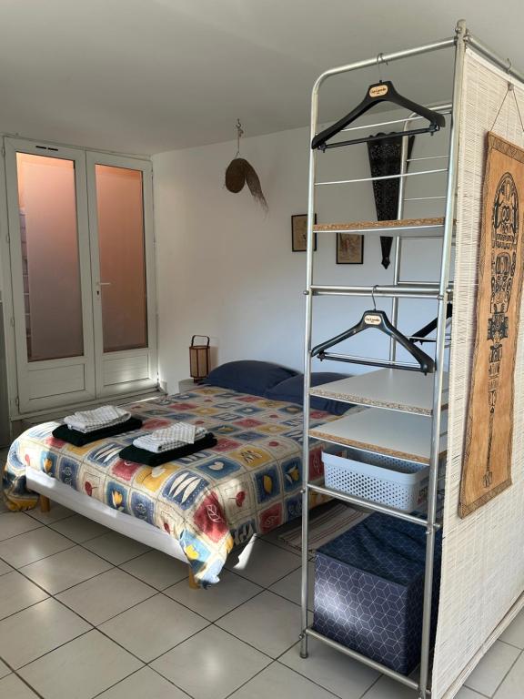 a bedroom with a bunk bed and a ladder at MAISON indépendante VUE MER au cœur de la NATURE in Toulon