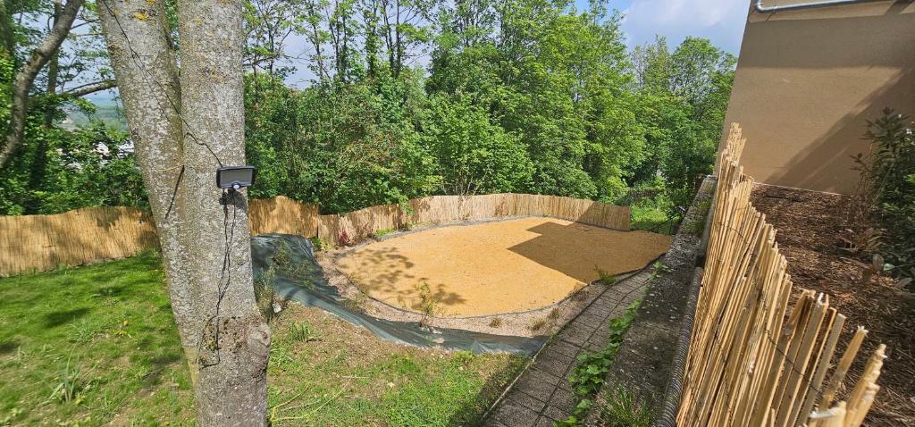 an aerial view of a backyard with a fence at Le Clos Maldier - Gîte de la Belle vue in Laon