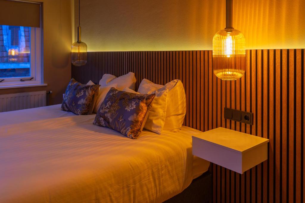 Postel nebo postele na pokoji v ubytování B&B Dijkhuis