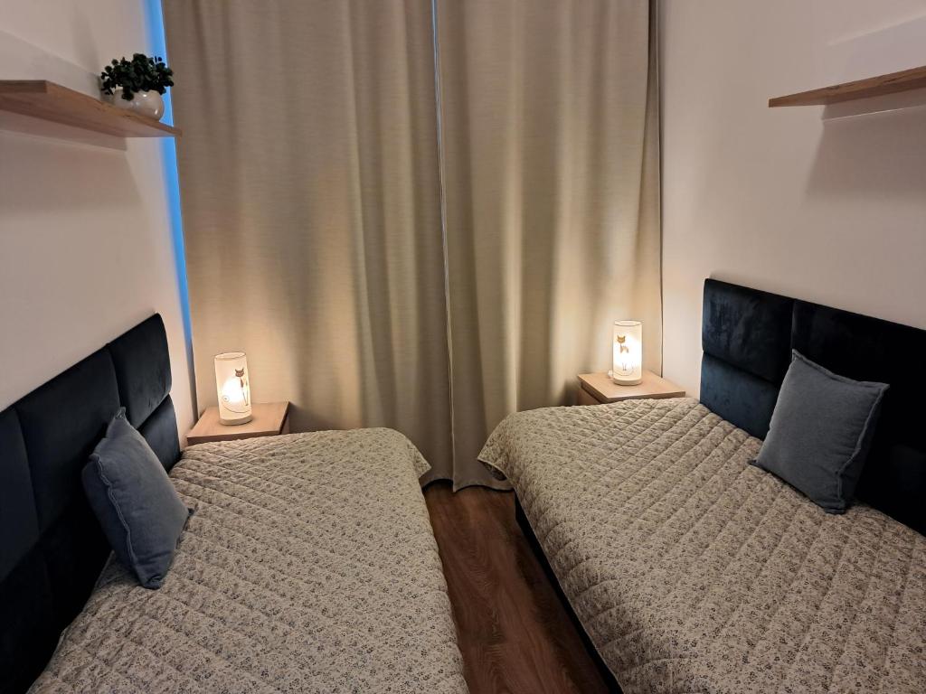 Postel nebo postele na pokoji v ubytování Apartmany Rubin Nesvady