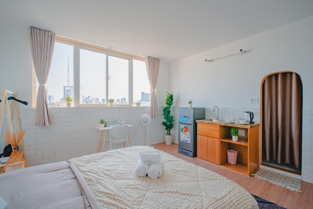 Postel nebo postele na pokoji v ubytování La Casa Di Dicembre HCMC