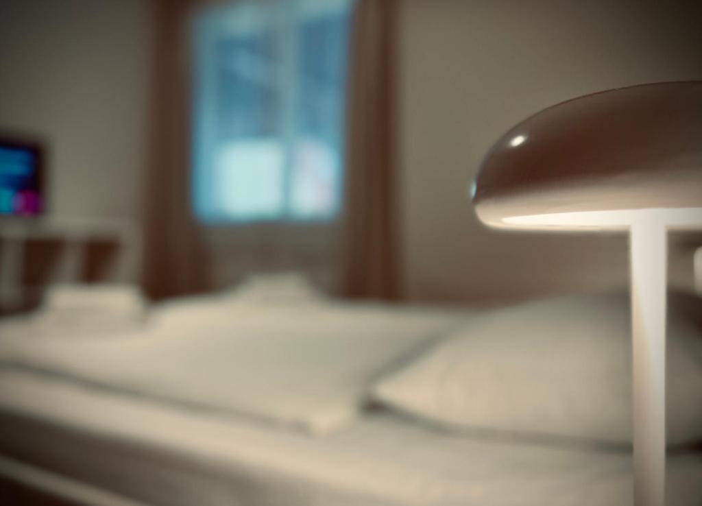 Postel nebo postele na pokoji v ubytování Nussbaum Panzió