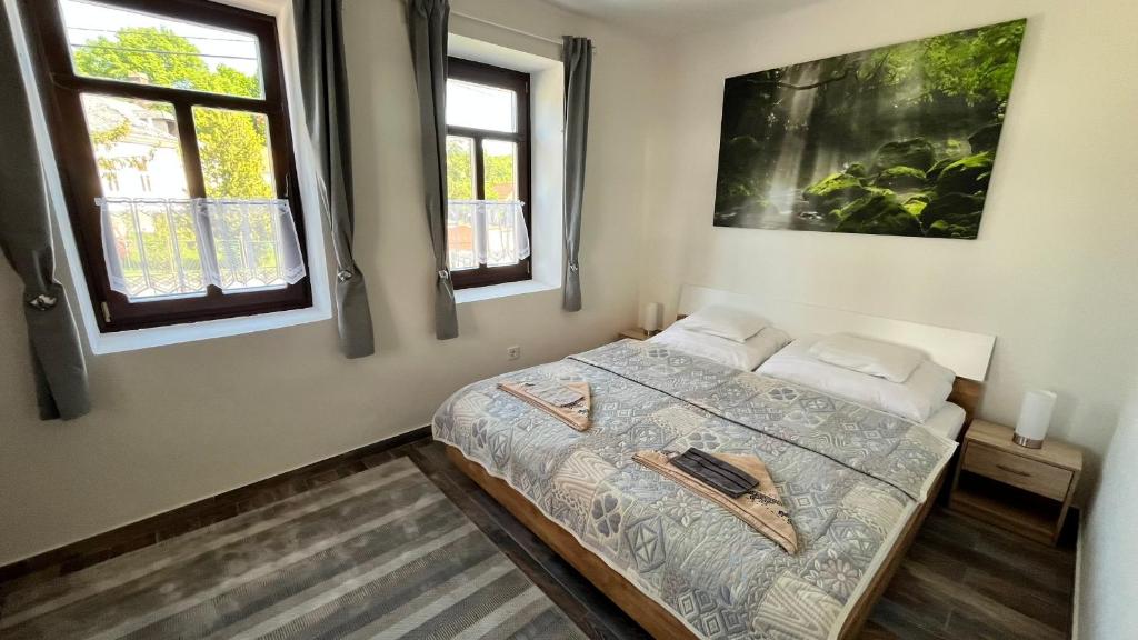 Postel nebo postele na pokoji v ubytování Udvar-ház