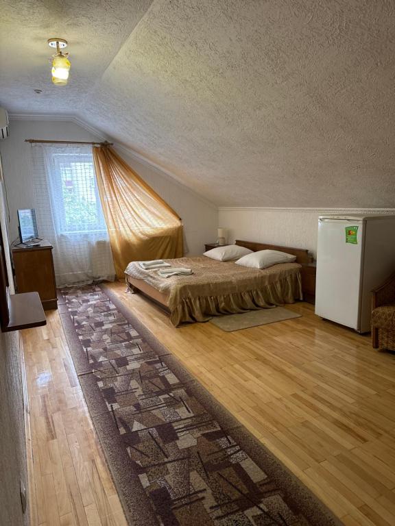 Postel nebo postele na pokoji v ubytování ЕЛІТ